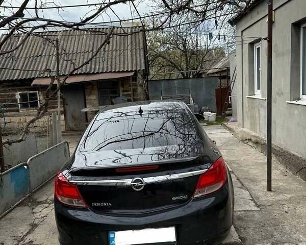 Черный Опель Инсигния, объемом двигателя 2 л и пробегом 255 тыс. км за 7300 $, фото 1 на Automoto.ua