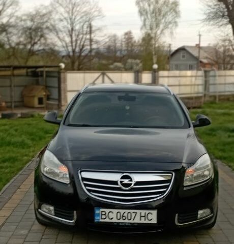 Черный Опель Инсигния, объемом двигателя 2 л и пробегом 244 тыс. км за 7700 $, фото 1 на Automoto.ua