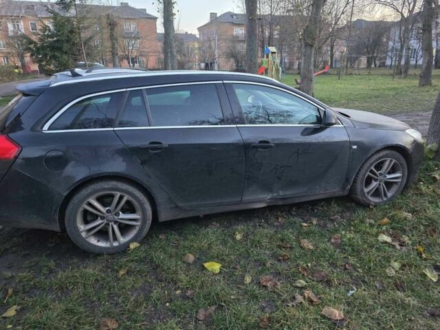 Черный Опель Инсигния, объемом двигателя 2 л и пробегом 305 тыс. км за 2800 $, фото 1 на Automoto.ua