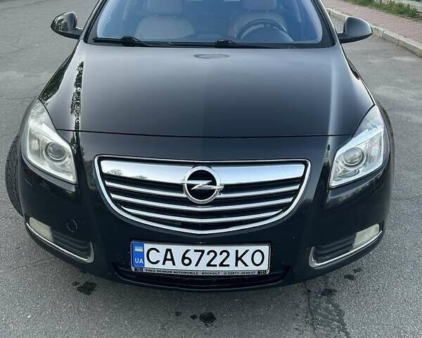 Черный Опель Инсигния, объемом двигателя 2 л и пробегом 395 тыс. км за 7300 $, фото 1 на Automoto.ua