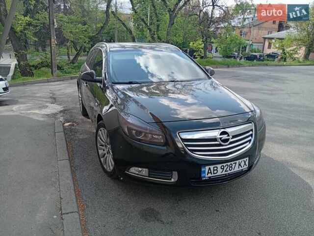 Черный Опель Инсигния, объемом двигателя 2 л и пробегом 325 тыс. км за 7200 $, фото 1 на Automoto.ua