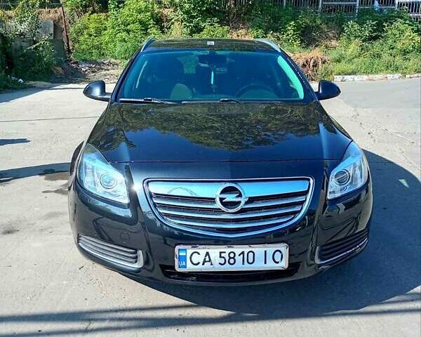 Черный Опель Инсигния, объемом двигателя 2 л и пробегом 322 тыс. км за 7500 $, фото 1 на Automoto.ua
