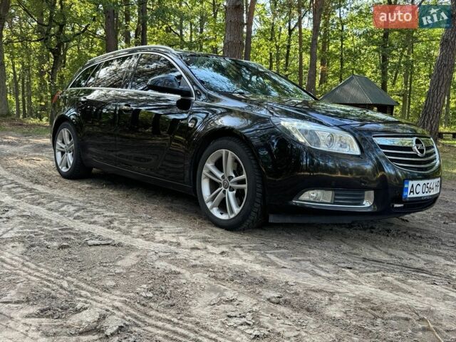Чорний Опель Інсігнія, об'ємом двигуна 2 л та пробігом 325 тис. км за 6500 $, фото 1 на Automoto.ua