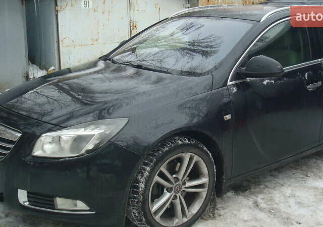 Чорний Опель Інсігнія, об'ємом двигуна 1.96 л та пробігом 247 тис. км за 9499 $, фото 1 на Automoto.ua