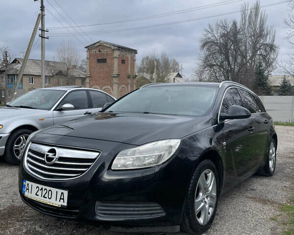 Чорний Опель Інсігнія, об'ємом двигуна 2 л та пробігом 220 тис. км за 7500 $, фото 1 на Automoto.ua