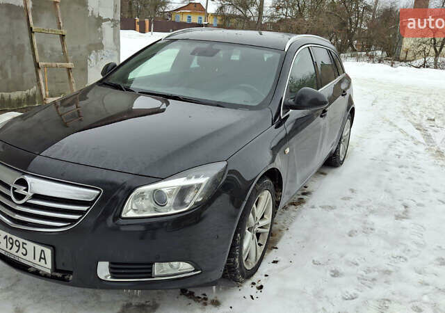 Чорний Опель Інсігнія, об'ємом двигуна 1.96 л та пробігом 176 тис. км за 10950 $, фото 1 на Automoto.ua