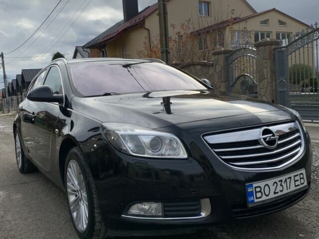 Чорний Опель Інсігнія, об'ємом двигуна 2 л та пробігом 280 тис. км за 10500 $, фото 1 на Automoto.ua