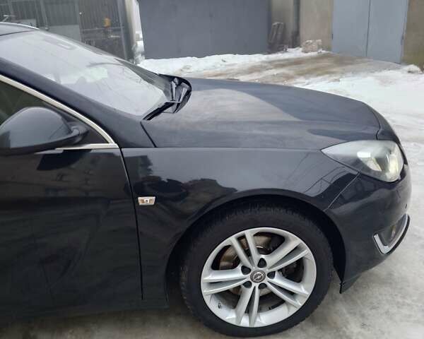 Черный Опель Инсигния, объемом двигателя 2 л и пробегом 323 тыс. км за 11500 $, фото 1 на Automoto.ua