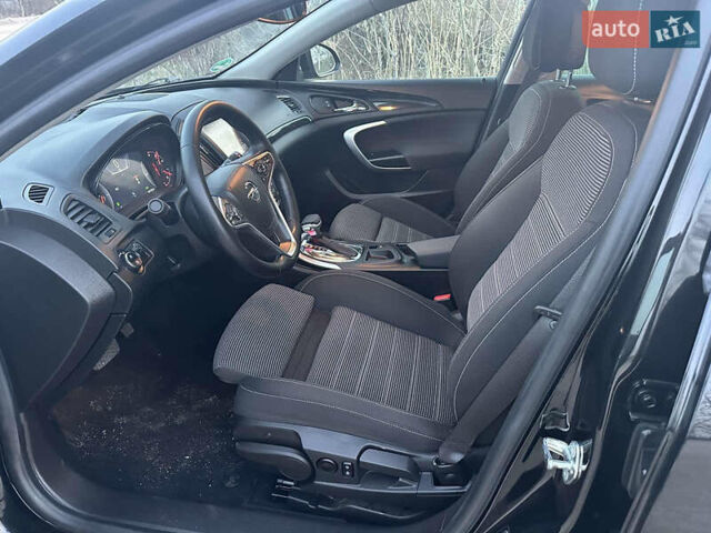 Черный Опель Инсигния, объемом двигателя 2 л и пробегом 140 тыс. км за 11500 $, фото 1 на Automoto.ua