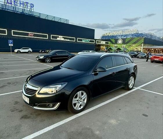 Черный Опель Инсигния, объемом двигателя 2 л и пробегом 170 тыс. км за 9500 $, фото 1 на Automoto.ua