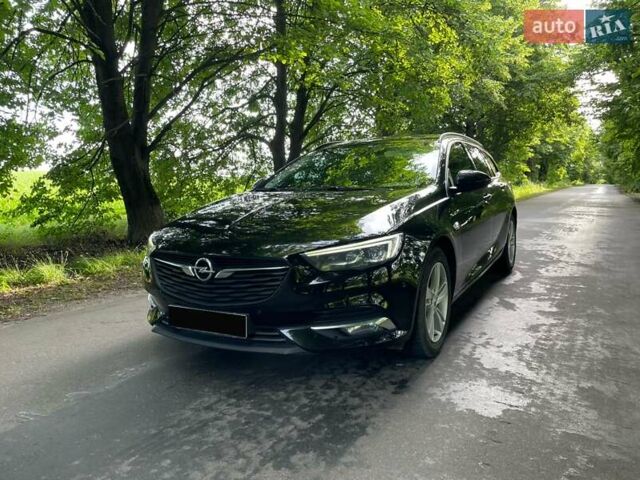 Черный Опель Инсигния, объемом двигателя 2 л и пробегом 235 тыс. км за 13950 $, фото 1 на Automoto.ua