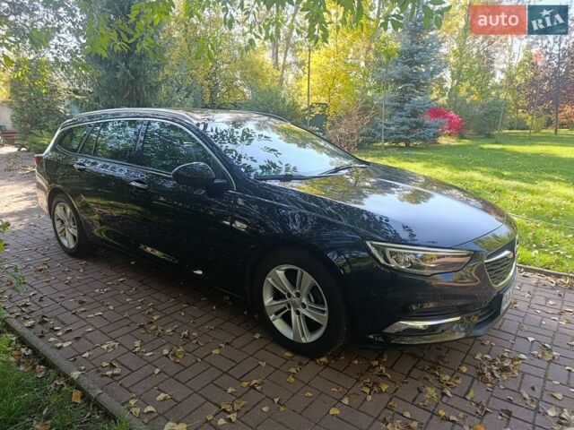 Чорний Опель Інсігнія, об'ємом двигуна 2 л та пробігом 180 тис. км за 15200 $, фото 1 на Automoto.ua