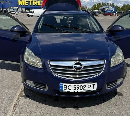 Синий Опель Инсигния, объемом двигателя 2 л и пробегом 253 тыс. км за 7500 $, фото 1 на Automoto.ua