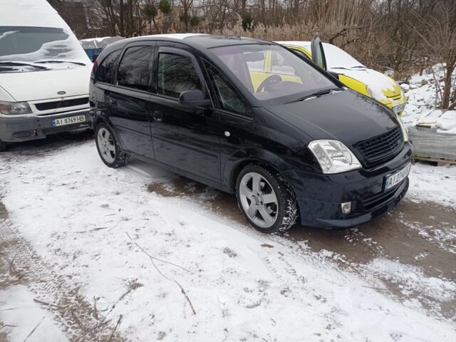 Черный Опель Мерива, объемом двигателя 0 л и пробегом 230 тыс. км за 4800 $, фото 1 на Automoto.ua