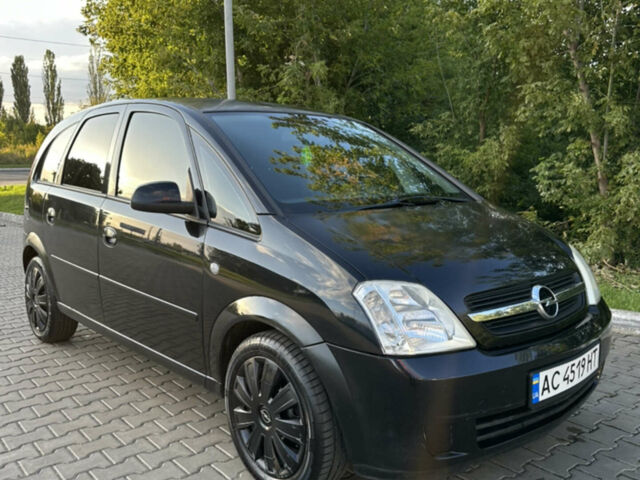 Черный Опель Мерива, объемом двигателя 1.6 л и пробегом 225 тыс. км за 4600 $, фото 1 на Automoto.ua
