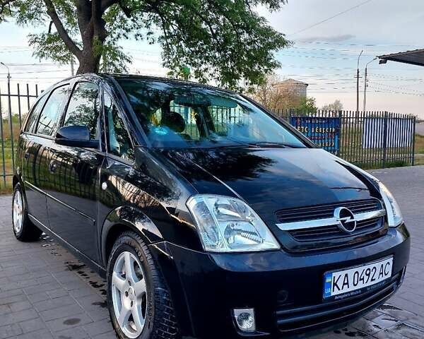 Черный Опель Мерива, объемом двигателя 1.6 л и пробегом 251 тыс. км за 4100 $, фото 1 на Automoto.ua
