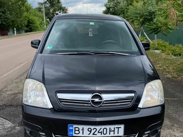 Черный Опель Мерива, объемом двигателя 1.6 л и пробегом 315 тыс. км за 3400 $, фото 1 на Automoto.ua