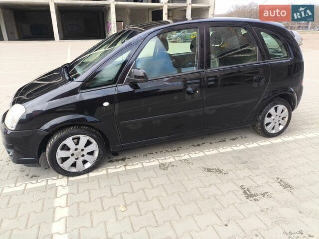 Черный Опель Мерива, объемом двигателя 1.7 л и пробегом 270 тыс. км за 3700 $, фото 1 на Automoto.ua