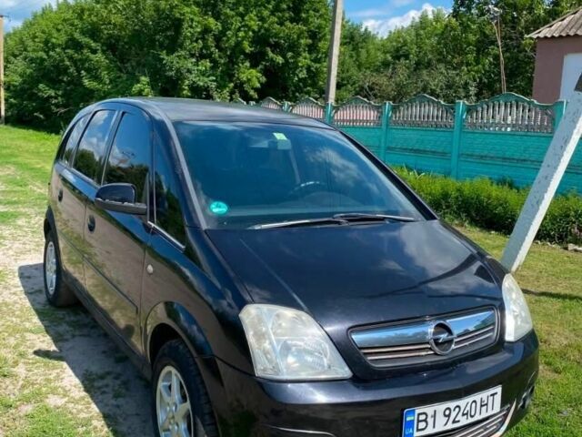 Черный Опель Мерива, объемом двигателя 1.6 л и пробегом 300 тыс. км за 3696 $, фото 1 на Automoto.ua