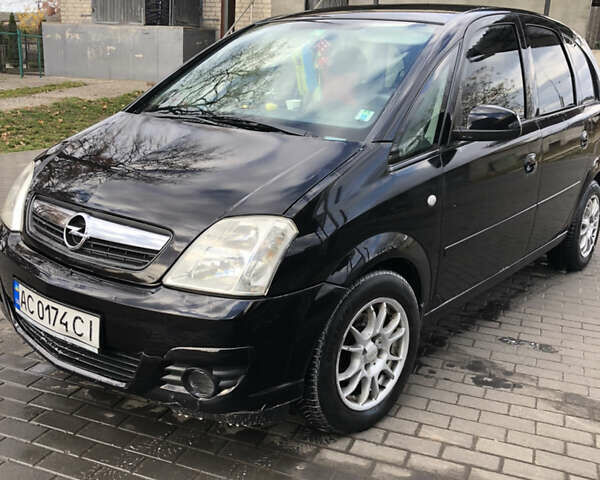 Черный Опель Мерива, объемом двигателя 1.25 л и пробегом 197 тыс. км за 3650 $, фото 1 на Automoto.ua