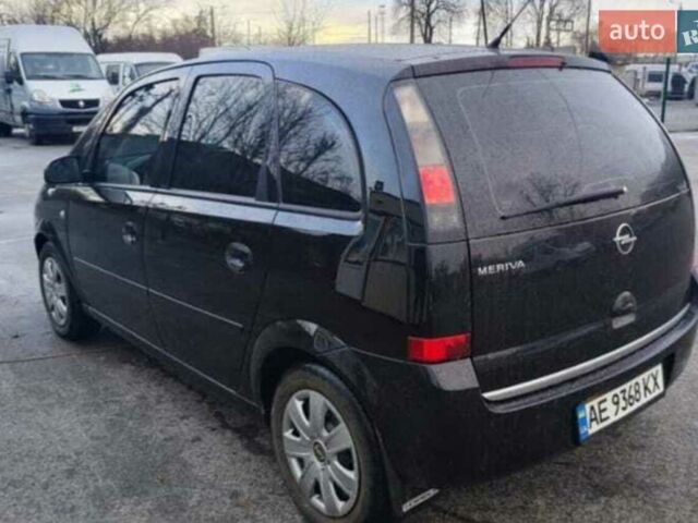 Черный Опель Мерива, объемом двигателя 1.36 л и пробегом 299 тыс. км за 4050 $, фото 1 на Automoto.ua