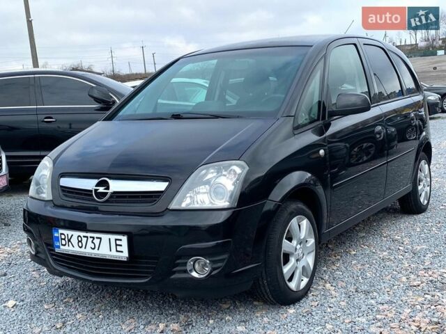 Черный Опель Мерива, объемом двигателя 1.6 л и пробегом 218 тыс. км за 4850 $, фото 1 на Automoto.ua