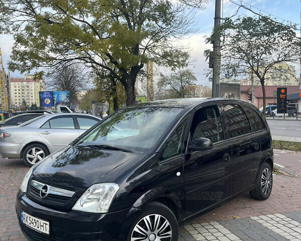 Черный Опель Мерива, объемом двигателя 1.6 л и пробегом 255 тыс. км за 4199 $, фото 1 на Automoto.ua