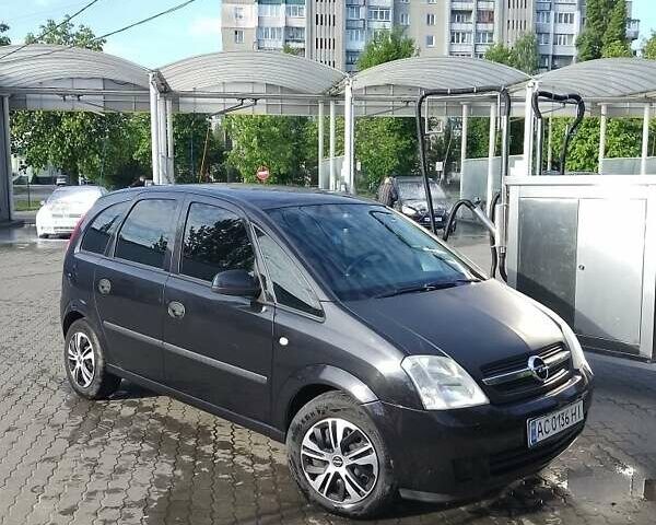 Черный Опель Мерива, объемом двигателя 1.6 л и пробегом 298 тыс. км за 3800 $, фото 1 на Automoto.ua