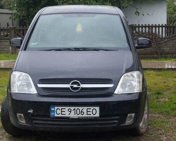 Черный Опель Мерива, объемом двигателя 1.8 л и пробегом 211 тыс. км за 3900 $, фото 1 на Automoto.ua