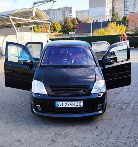 Черный Опель Мерива, объемом двигателя 1.8 л и пробегом 230 тыс. км за 5500 $, фото 1 на Automoto.ua