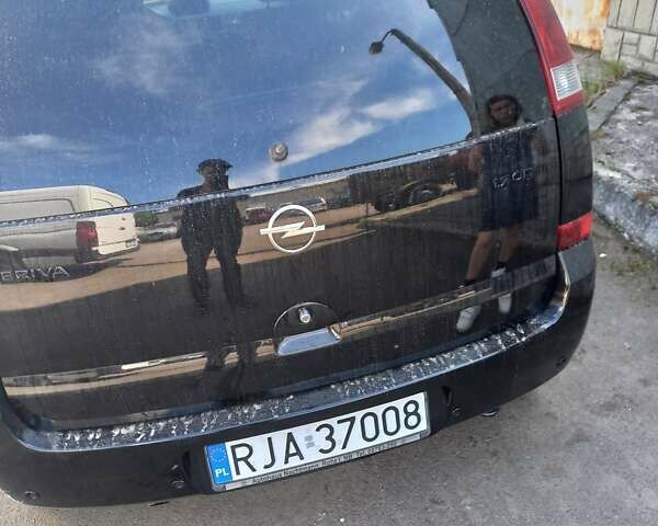 Черный Опель Мерива, объемом двигателя 1.7 л и пробегом 208 тыс. км за 3000 $, фото 1 на Automoto.ua