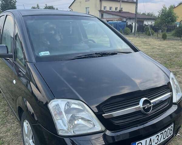 Черный Опель Мерива, объемом двигателя 1.7 л и пробегом 240 тыс. км за 2948 $, фото 1 на Automoto.ua