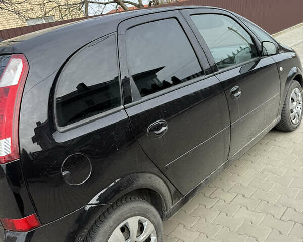 Черный Опель Мерива, объемом двигателя 1.6 л и пробегом 157 тыс. км за 4400 $, фото 1 на Automoto.ua