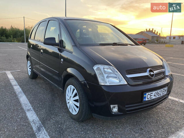 Черный Опель Мерива, объемом двигателя 1.4 л и пробегом 215 тыс. км за 3900 $, фото 1 на Automoto.ua