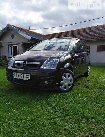 Черный Опель Мерива, объемом двигателя 1.3 л и пробегом 134 тыс. км за 4500 $, фото 1 на Automoto.ua