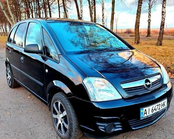 Черный Опель Мерива, объемом двигателя 1.6 л и пробегом 280 тыс. км за 4300 $, фото 1 на Automoto.ua