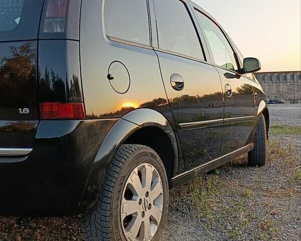 Черный Опель Мерива, объемом двигателя 1.6 л и пробегом 147 тыс. км за 5700 $, фото 1 на Automoto.ua