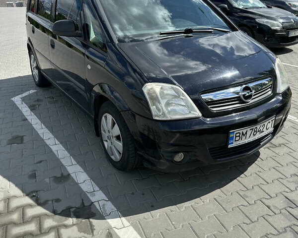 Черный Опель Мерива, объемом двигателя 1.6 л и пробегом 170 тыс. км за 3700 $, фото 1 на Automoto.ua