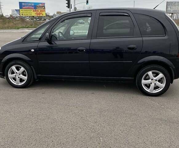 Черный Опель Мерива, объемом двигателя 1.6 л и пробегом 216 тыс. км за 4300 $, фото 1 на Automoto.ua