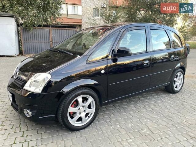 Черный Опель Мерива, объемом двигателя 1.8 л и пробегом 260 тыс. км за 5800 $, фото 1 на Automoto.ua