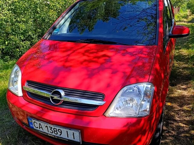 Красный Опель Мерива, объемом двигателя 1.6 л и пробегом 211 тыс. км за 4200 $, фото 1 на Automoto.ua