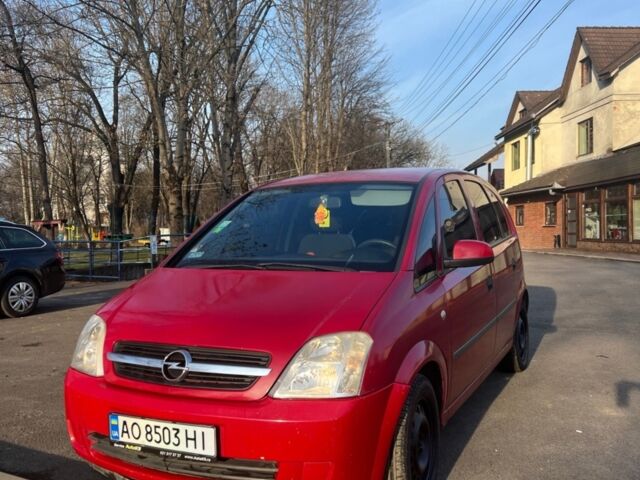 Красный Опель Мерива, объемом двигателя 1.69 л и пробегом 369 тыс. км за 3200 $, фото 1 на Automoto.ua