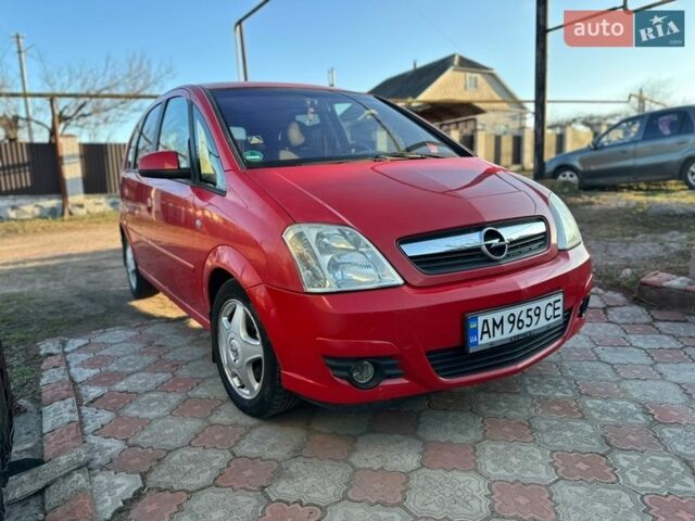 Красный Опель Мерива, объемом двигателя 1.6 л и пробегом 212 тыс. км за 3899 $, фото 1 на Automoto.ua