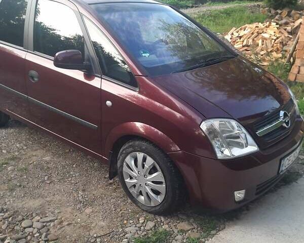 Красный Опель Мерива, объемом двигателя 1.8 л и пробегом 174 тыс. км за 4600 $, фото 1 на Automoto.ua