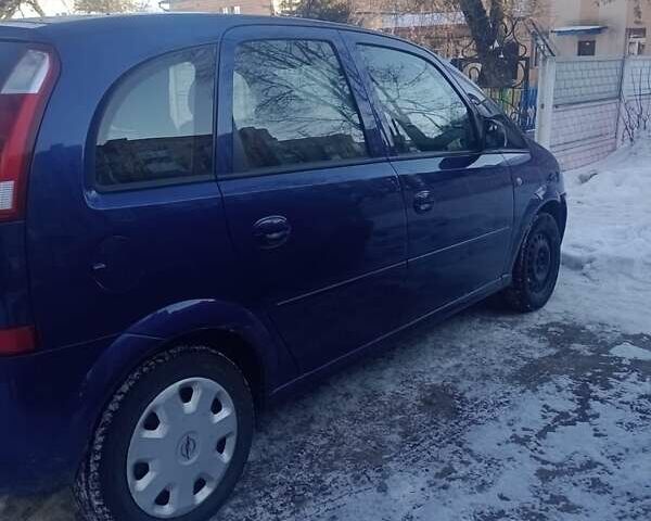 Синий Опель Мерива, объемом двигателя 1.6 л и пробегом 255 тыс. км за 4400 $, фото 1 на Automoto.ua