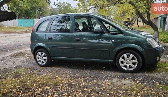 Зеленый Опель Мерива, объемом двигателя 1.6 л и пробегом 320 тыс. км за 5500 $, фото 1 на Automoto.ua