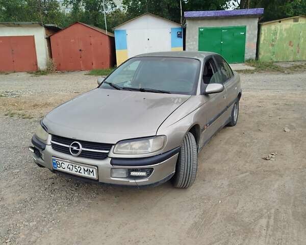 Бежевий Опель Омега, об'ємом двигуна 2 л та пробігом 250 тис. км за 1400 $, фото 1 на Automoto.ua