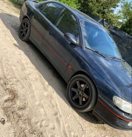 Черный Опель Омега, объемом двигателя 2.5 л и пробегом 247 тыс. км за 2300 $, фото 1 на Automoto.ua