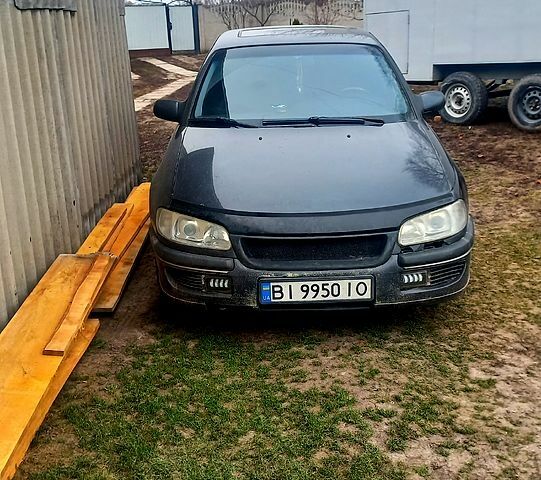 Черный Опель Омега, объемом двигателя 2.5 л и пробегом 338 тыс. км за 1600 $, фото 1 на Automoto.ua