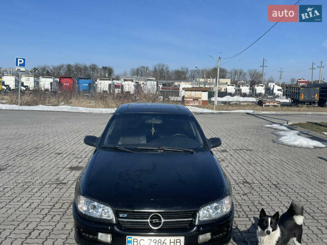 Черный Опель Омега, объемом двигателя 2.5 л и пробегом 370 тыс. км за 1600 $, фото 1 на Automoto.ua